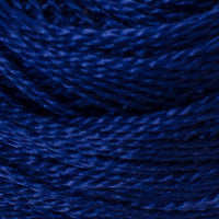 A close-up of dark blue yarn wound into soft loops, showing the texture and color of the thread.