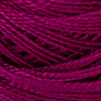 A close-up of thick, twisted yarn in a rich magenta-purple color, filling the entire frame.