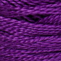 A close-up of thick purple yarn strands, showing the texture and color of the thread.